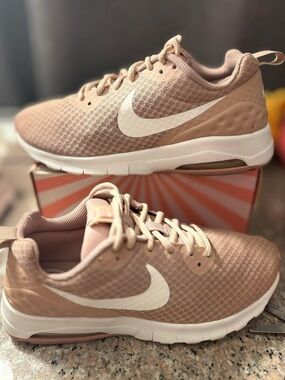 Nike Women’s Blush Pink Mesh Athletic Sneakers with White Swoosh